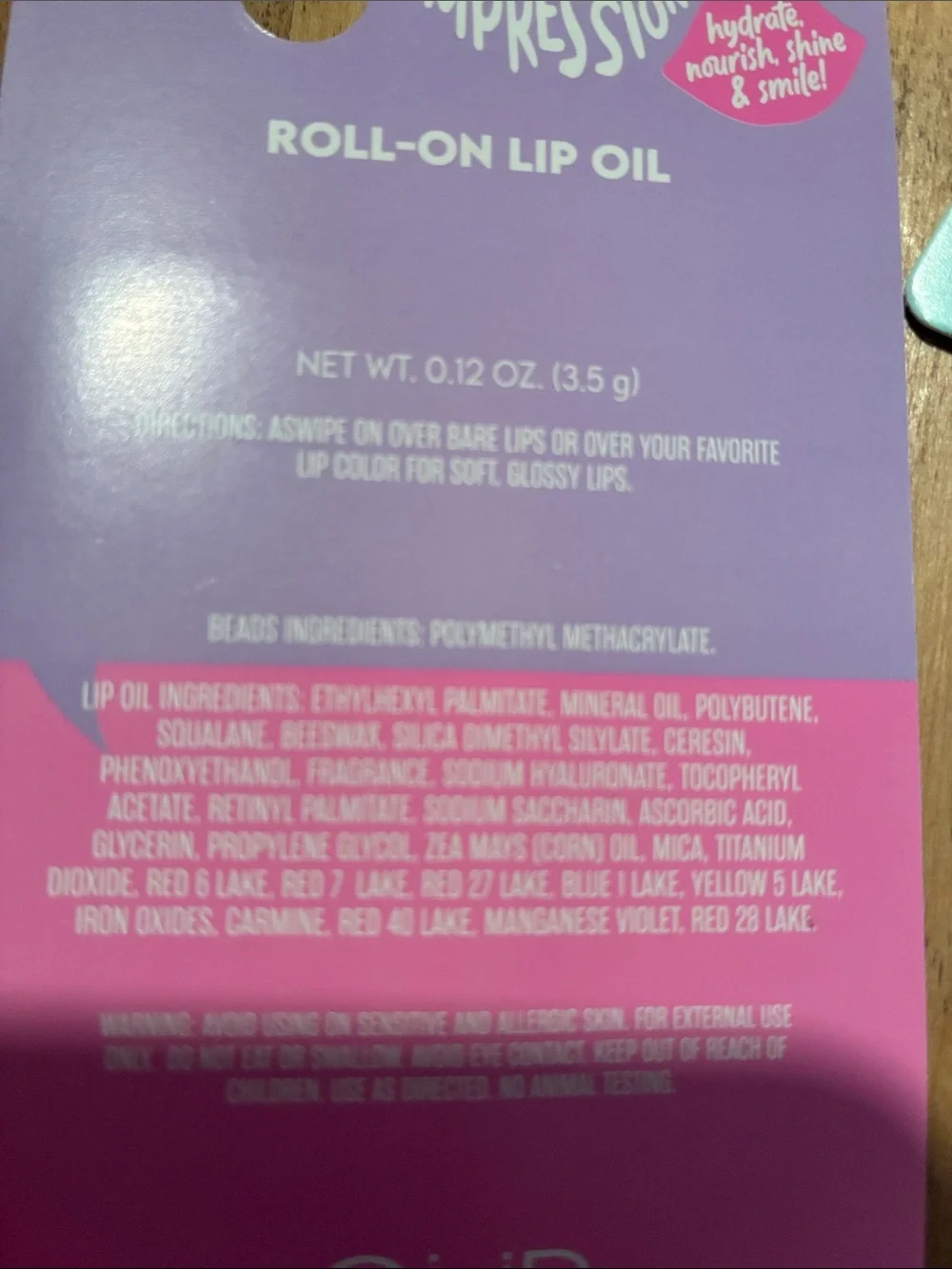 Impressions Roll-On Lip Oil Duo in Pink and Purple Packaging